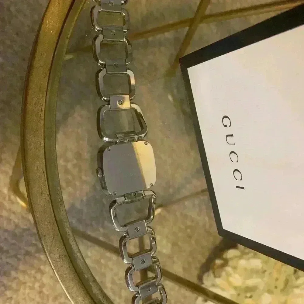 Gucci G watch Silver with Dark Bronze Face With Diamonds.
